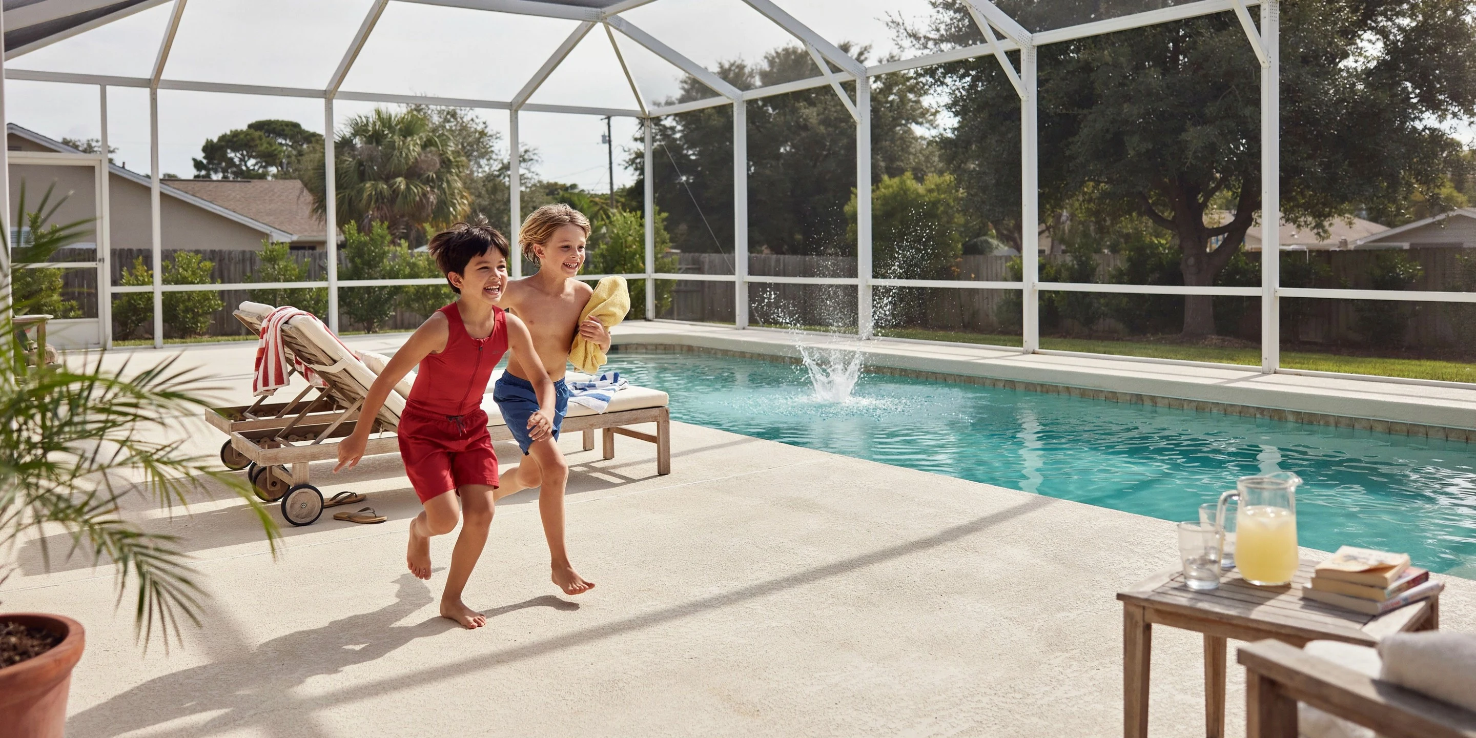 Family in a screened pool cage in The Trails, Sarasota, FL